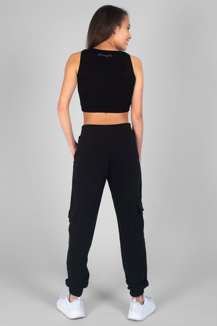 Girl wearing black Cargo Joggers and sleeveless black Crop Dance Vest