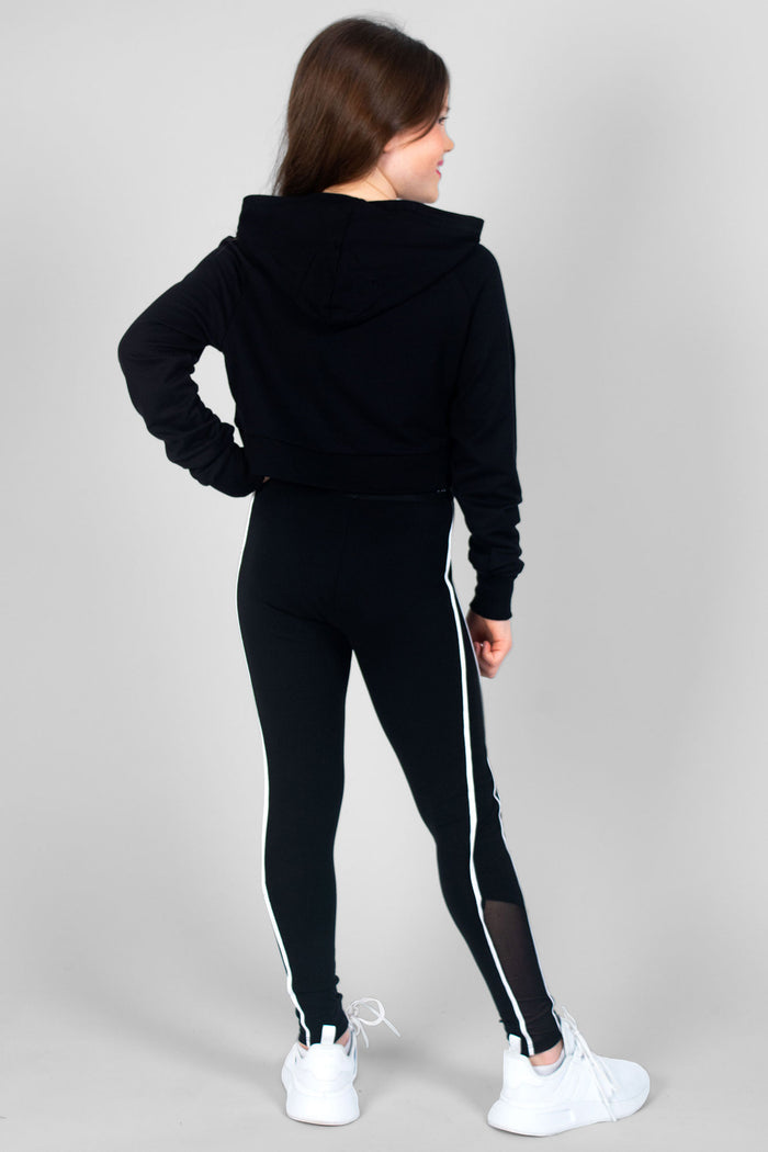 Girl wearing black Crop Hoodie and black Jacquard Piping Leggings with mesh panels