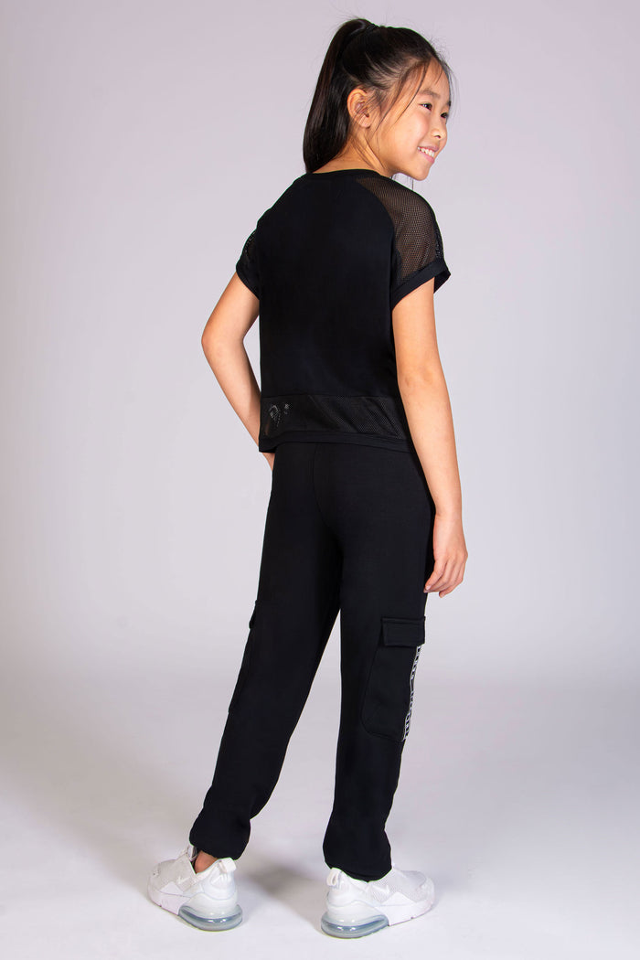 Shop the ultimate dance t-shirt for girls with sparkly dance print and mesh sleeves by Pineapple Dance Studios.