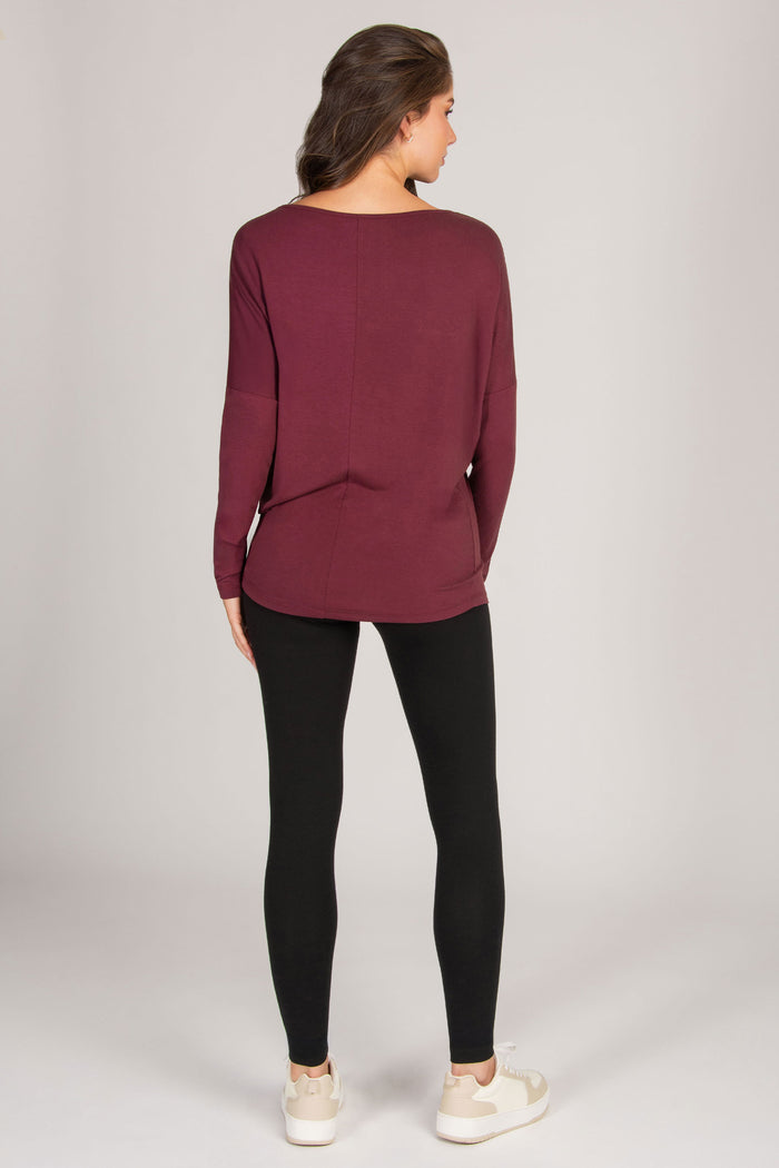women's burgundy long sleeve top with scoop back and fitted sleeves