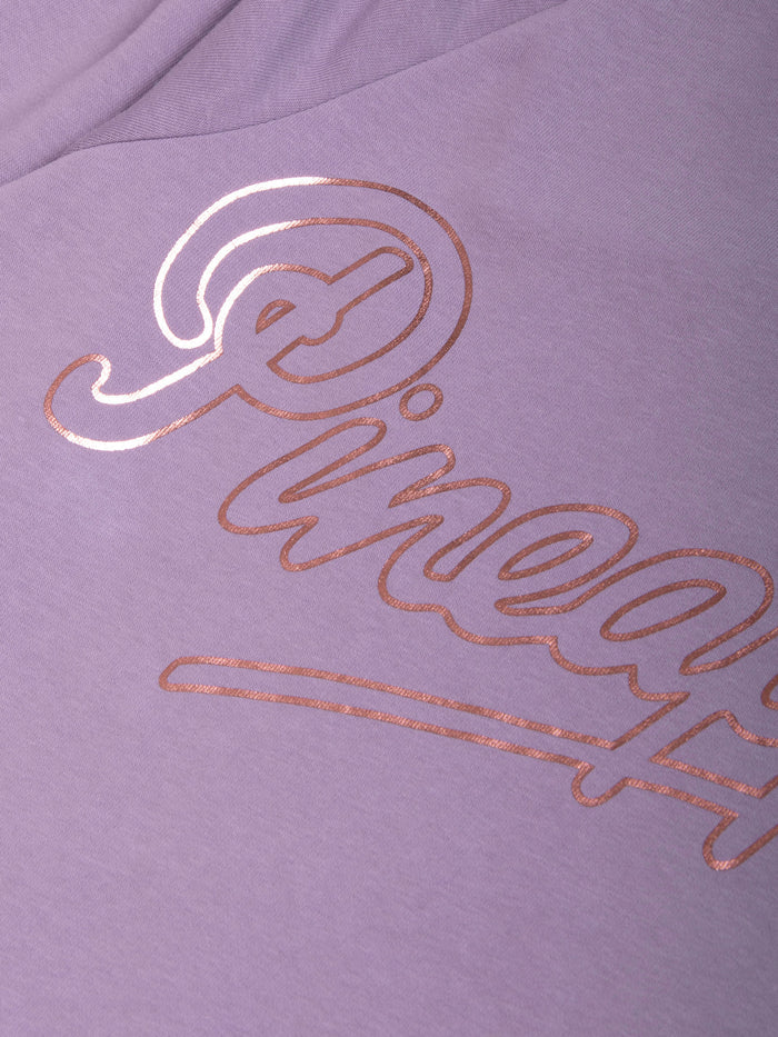 Detail shot of rose gold foil print across the sweater.