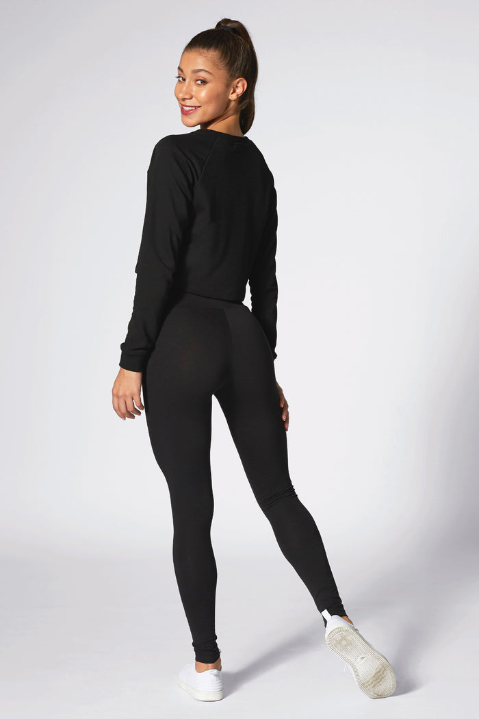 Kaory Desole wearing Pineapple leggings with matching black top