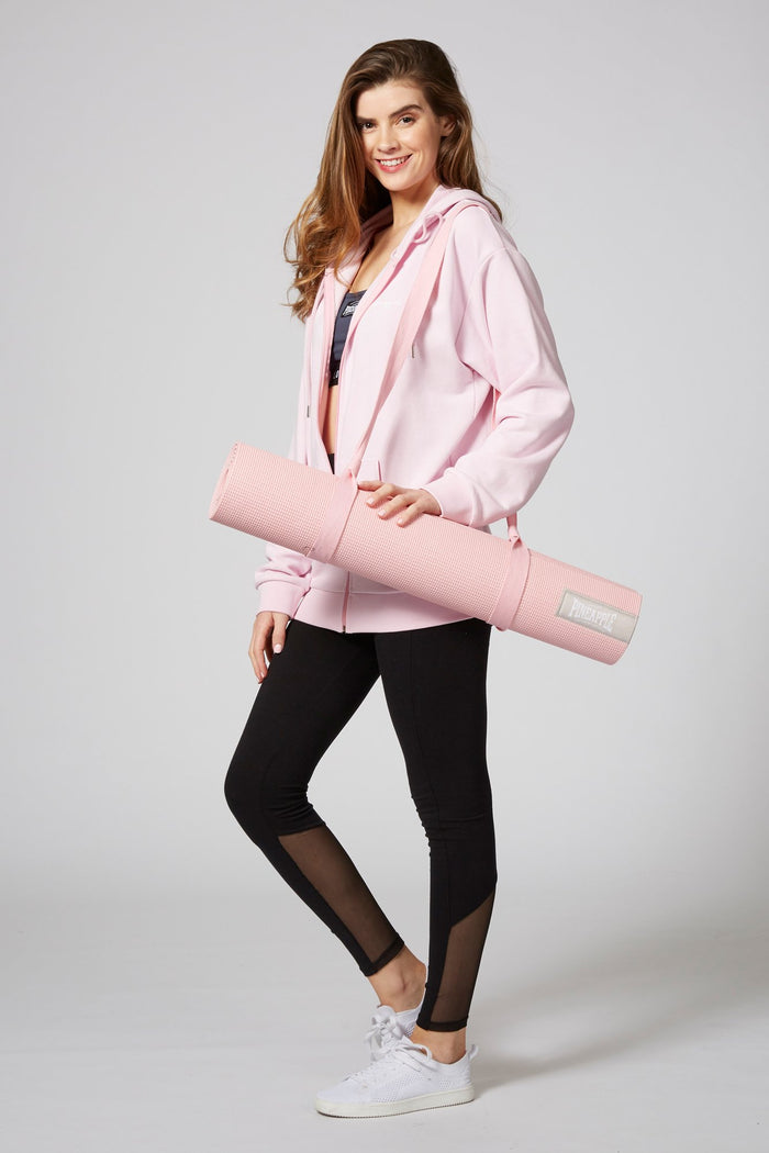 Woman carrying Pineapple Dance Pink Badge Yoga Mat