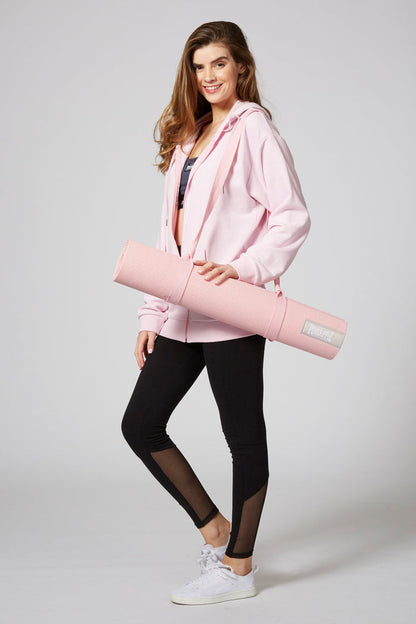 Woman carrying Pineapple Dance Pink Badge Yoga Mat