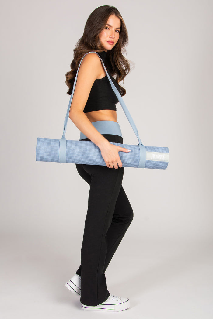 Pale blue exercise mat with holder for easy carrying.