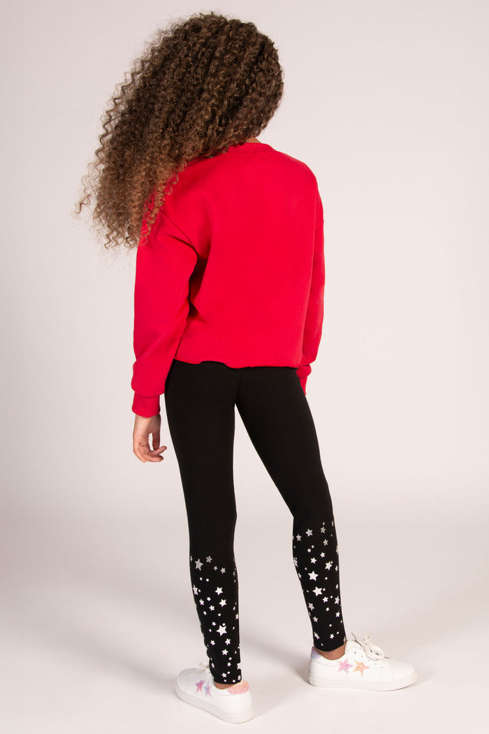 Kids' red jumper paired with black Pineapple leggings designed by Pineapple Dance Studios.