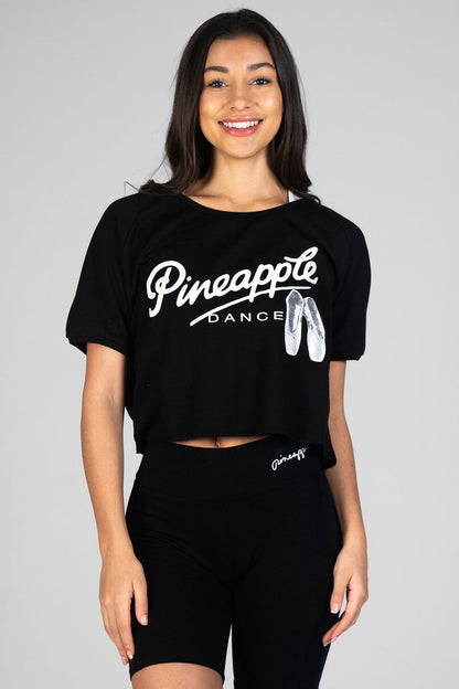 Woman wearing Pineapple black Ballet Slouchy T-Shirt and black Cycling Shorts
