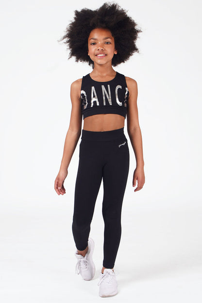 Girl wearing Black Band Leggings with hip logo and black crop dance vest with silver print