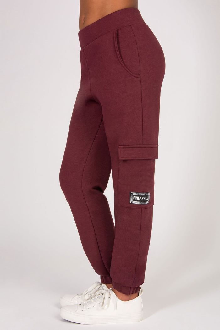 Maroon cargo jogger pants with pockets on a white background