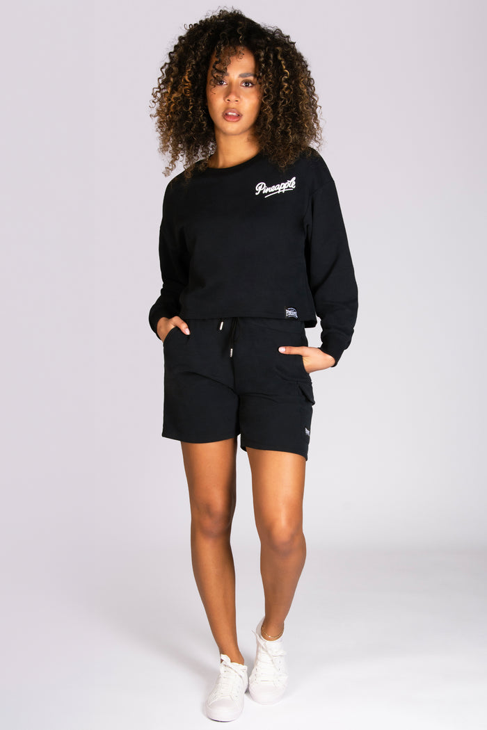 Women's black oversized shorts in a cargo style designed by Pineapple Dance Studios