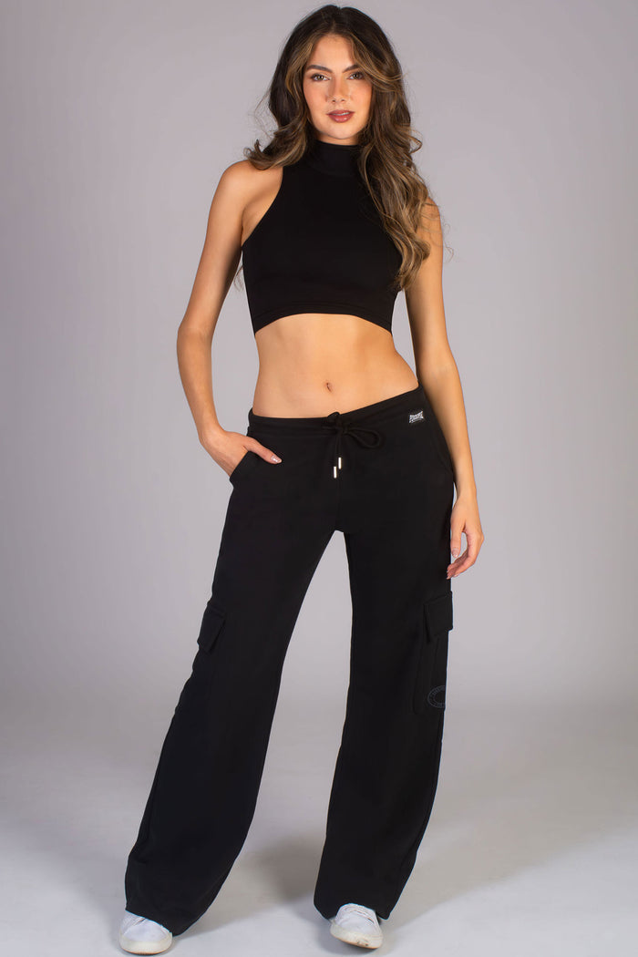 Kianna Louise wearing wide leg trousers in black from Pineapple