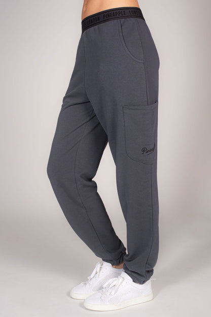 Women's grey combat joggers with multiple pockets and branded waistband.