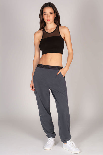 Martyna Balsam modelling for Pineapple Dance Studios wearing dark grey joggers for women.