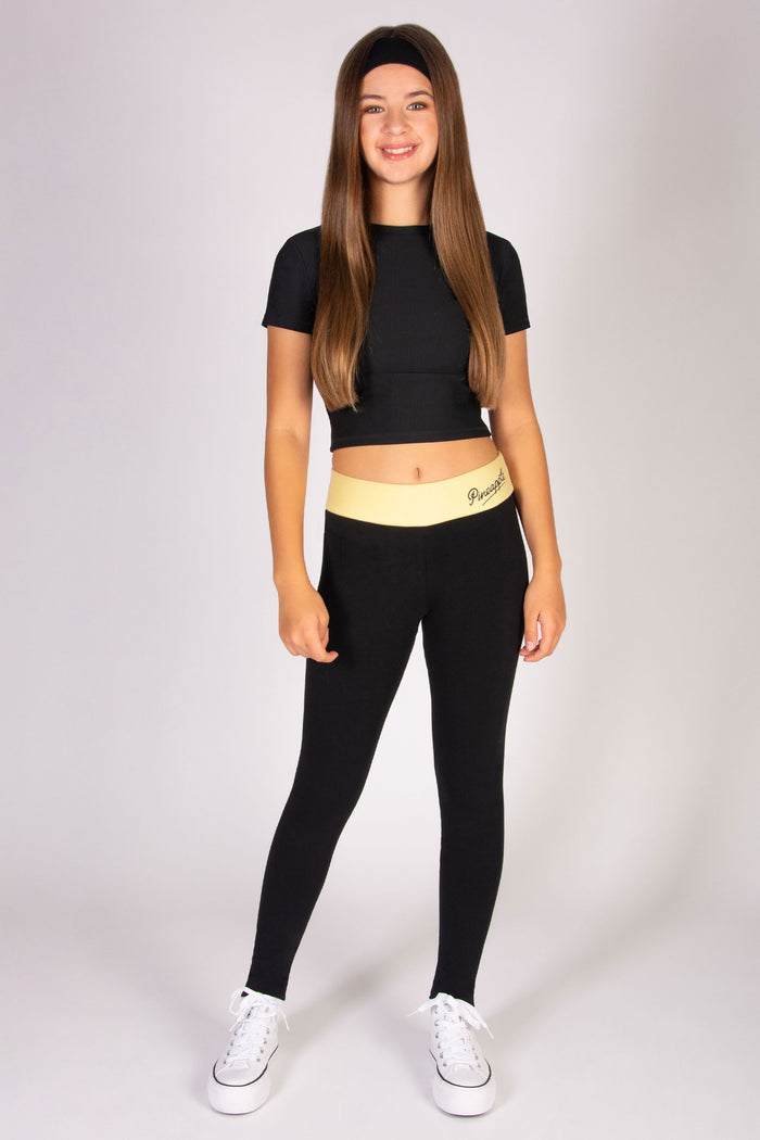 Black cotton-rich stretchy leggings with butter yellow waistband.
