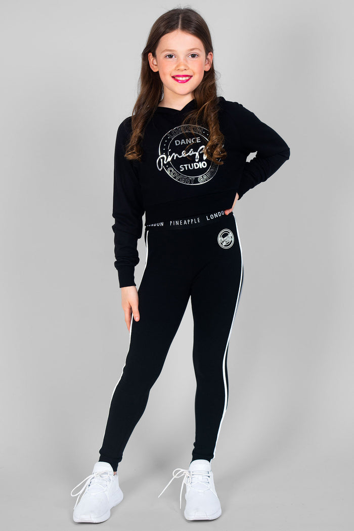 Girl wearing black Crop Hoodie and black leggings