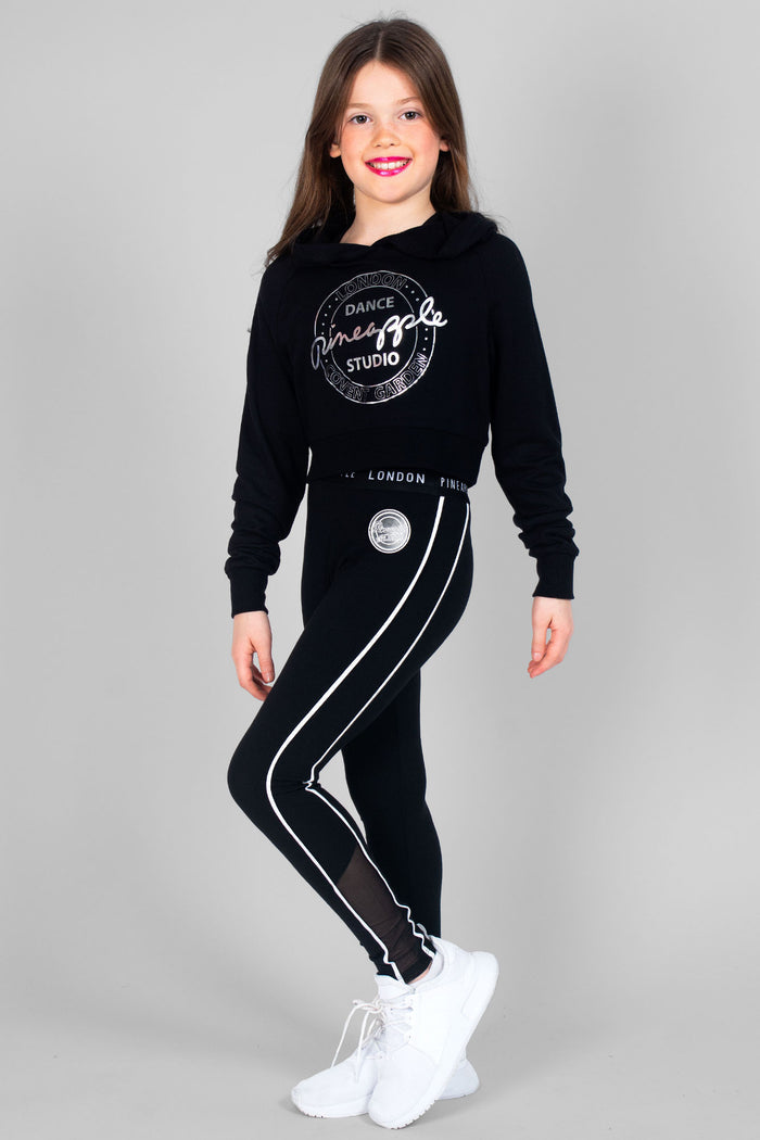 Girl wearing black Crop Hoodie and black Jacquard Piping Leggings with double stripes