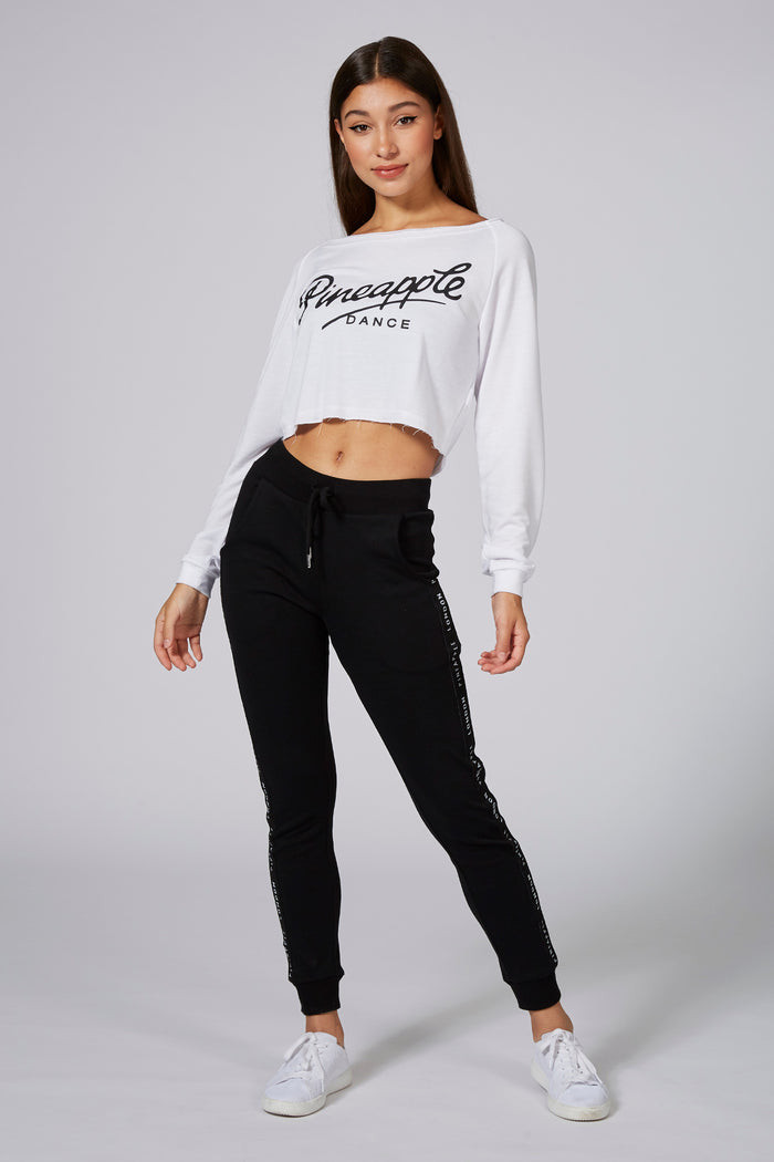 Woman wearing White Retro Off Shoulder Logo Crop Top