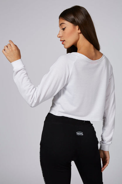 Woman wearing White Retro Off Shoulder Logo Crop Top and black leggings