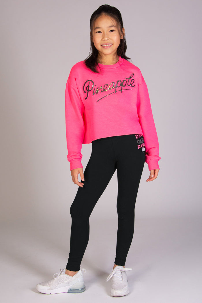 Neon pink sweater for girls with silver foil embossed Pineapple logo across the chest