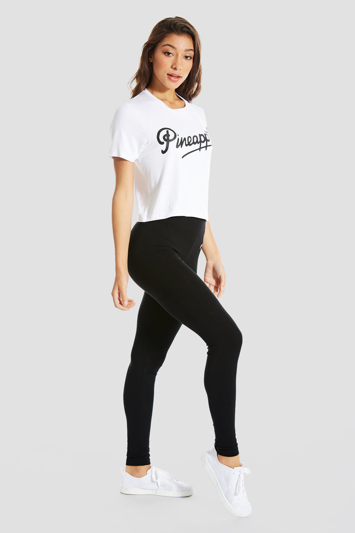 Woman wearing White Crop T-Shirt with logo