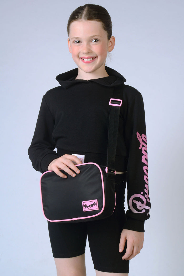 Girl carrrying black Crossbody Bag for kids