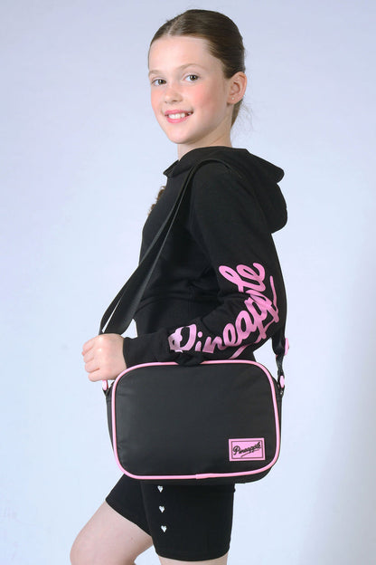 Girls carrying black Crossbody Bag with pink piping and logo