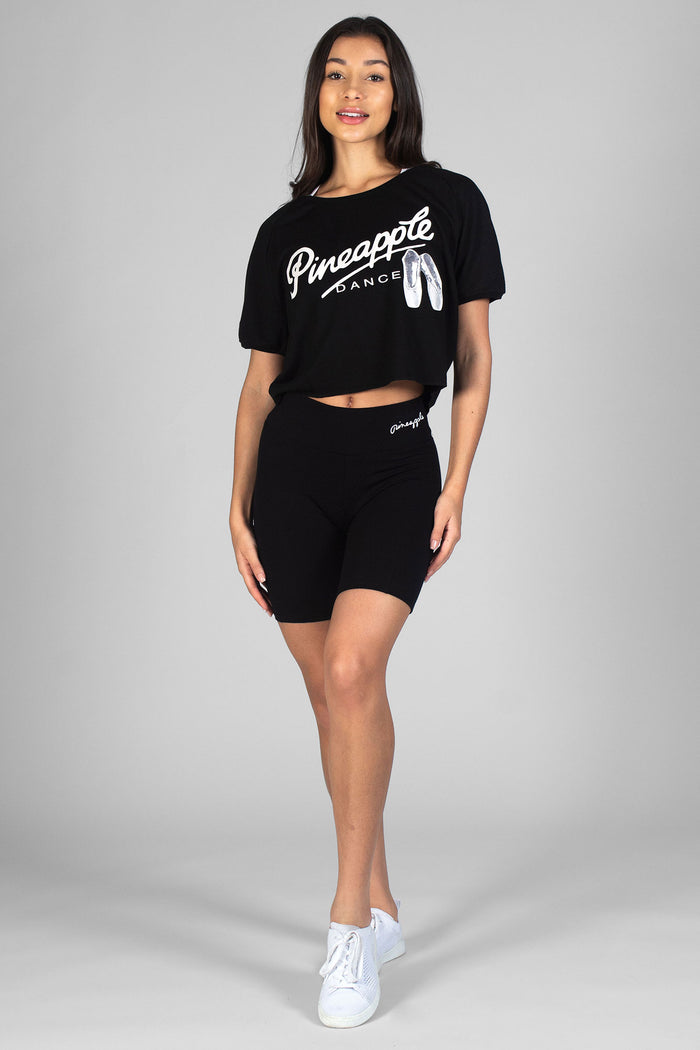 Woman wearing black Cycling Shorts and black Slouchy Ballet T-Shirt