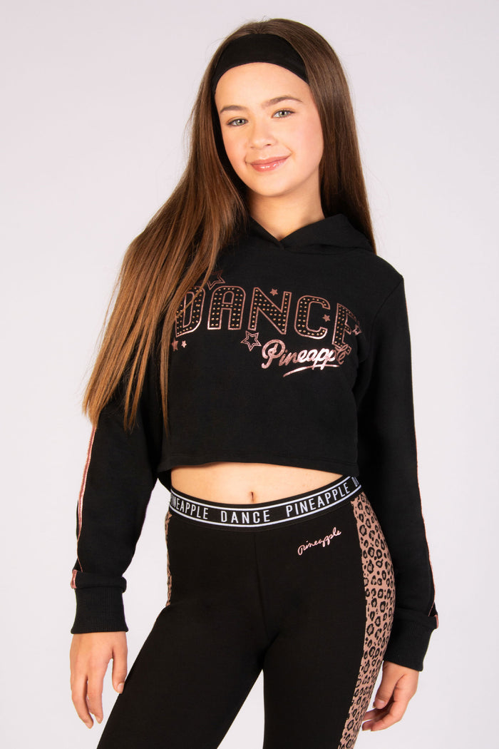 girls' black dance hoodie with rose gold stars and foil sleeve paneling by Pineapple Dance Studios
