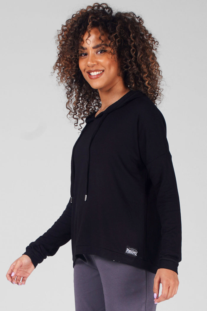 Woman wearing Black Dip Hem Hoodie