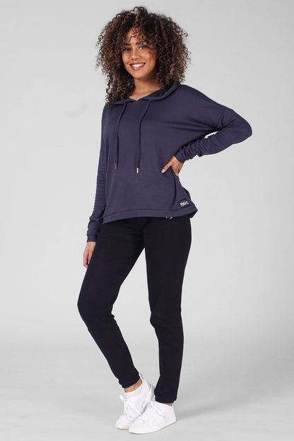Woman wearing Charcoal Dip Hem Hoodie and black jogging trousers