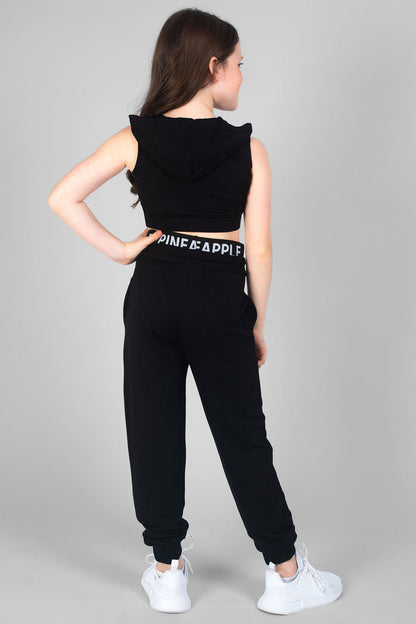 Girl wearing Black Double Track Pants and cropped black Sleeveless Hoodie