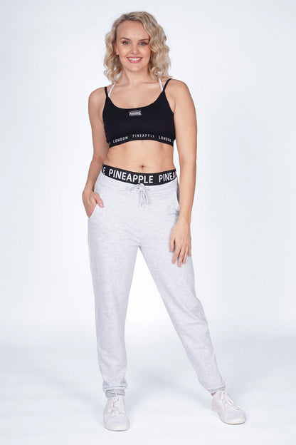 Woman wearing Grey Double Band Joggers and Black Bra Top with Logo Bands