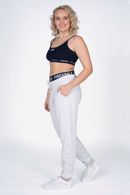 Woman wearing Grey Double Band Joggers and Black Bra Top