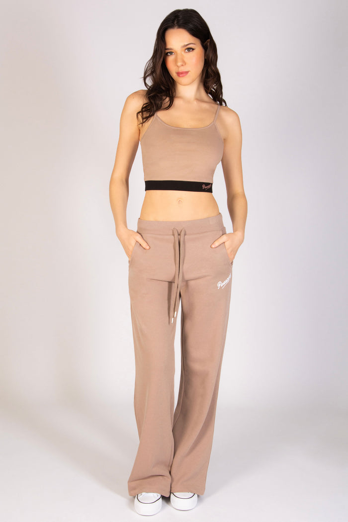 Light brown straight leg trousers with side pockets and elasticated waistband