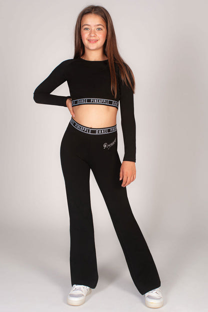 Girls dance set completed with black bootcut trousers and kids Pineapple crop top