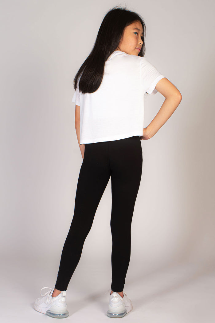 Kids' black leggings with folder waistband by Pineapple Dance Studios.