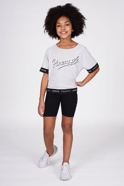 Girl wearing Heart Stud Black Cycling Shorts with grey jacquard t-shirt