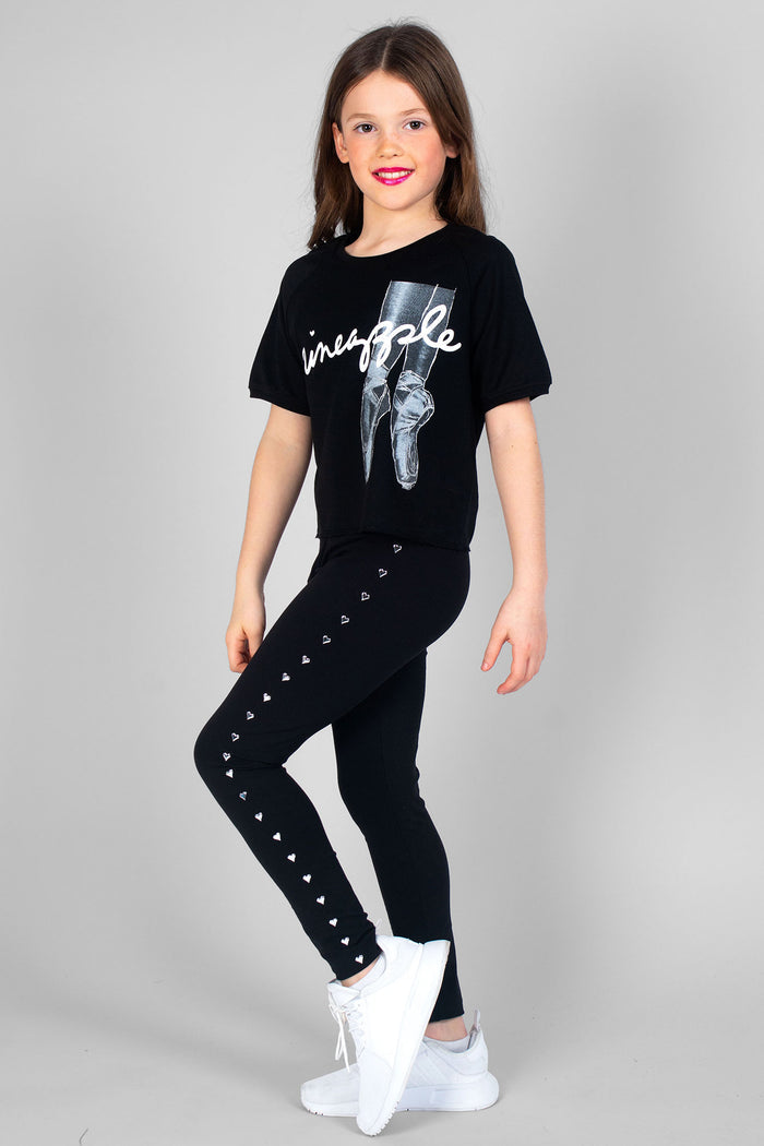 Girl wearing black Heart Stud Leggings and logo black Ballet Slouchy T-Shirt