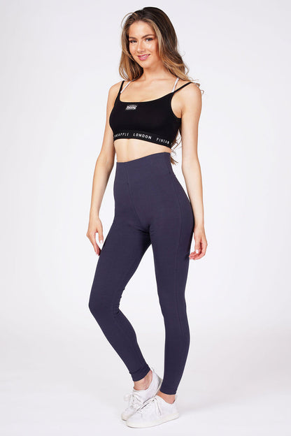Woman wearingNavy High Waist Leggings and black bra top with logo hem