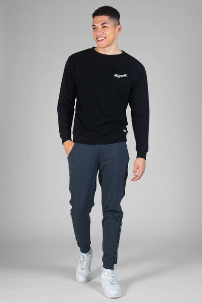 Man wearing charcoal Jacquard Joggers and black sweatshirt