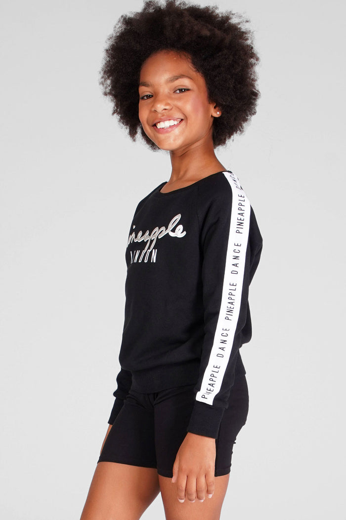 Girl wearing Jacquard Sweat Top and black cycling shorts