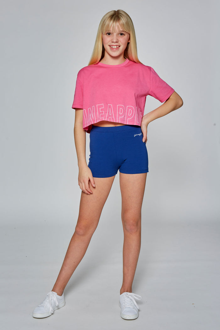 Girl wearing Pineapple Navy Hotpants