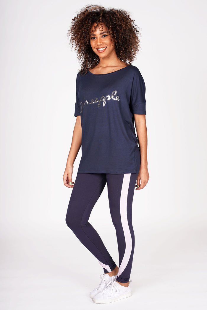 Woman wearing Charcoal Viscose T-Shirt with silver logo and charcoal racer stripe leggings