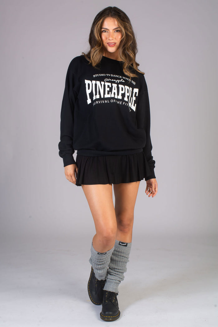 Kianna Louise wearing fashionable leg warmers with mini skirt and oversized sweater