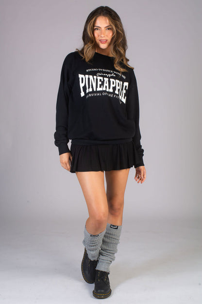 Kianna Louise wearing fashionable leg warmers with mini skirt and oversized sweater