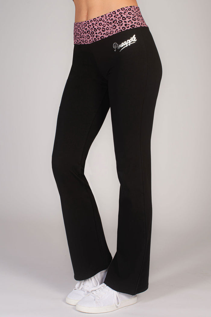 women's black flared trousers with pink leopard waist band