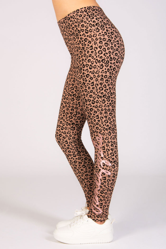 Girls' all over leopard print leggings in brown available in sizes 5-13.