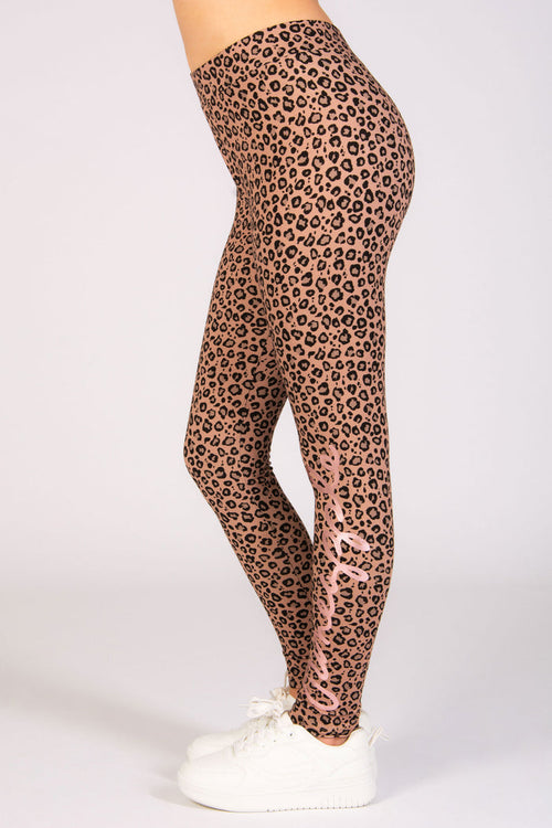 Girls' all over leopard print leggings in brown available in sizes 5-13.