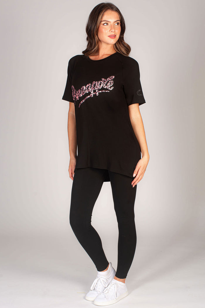 Women's black leopard print chest logo boyfriend t-shirt paired with high waisted dance leggings.