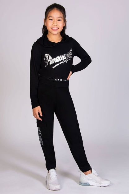 Black dance hoodie for girls paired with black cargo joggers designed by Pineapple Dance Studios.
